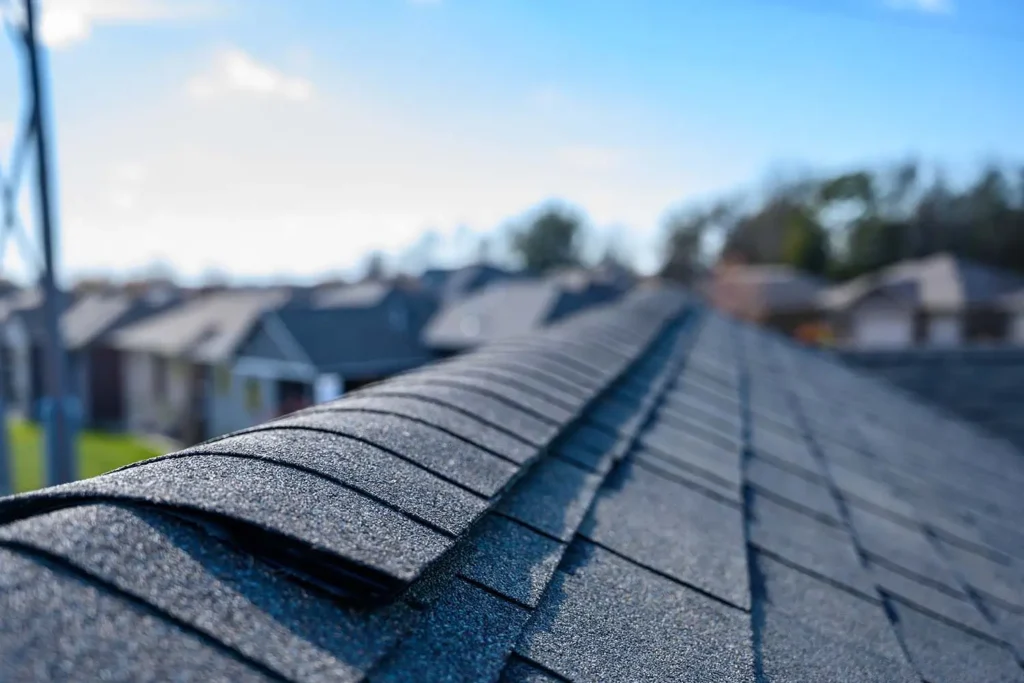 Close-up view of ridge shingles on an asphalt roof, neatly layered by Northland Roofing.
