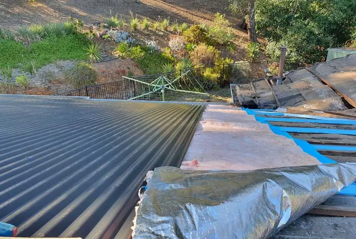 Newly installed insulation and roofing sheets by Northland Roofing as part of a re-roofing upgrade.