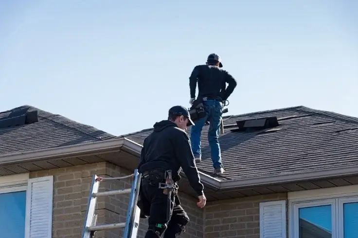 Northland Roofing professionals performing a roof inspection to assess damage and ensure safety.