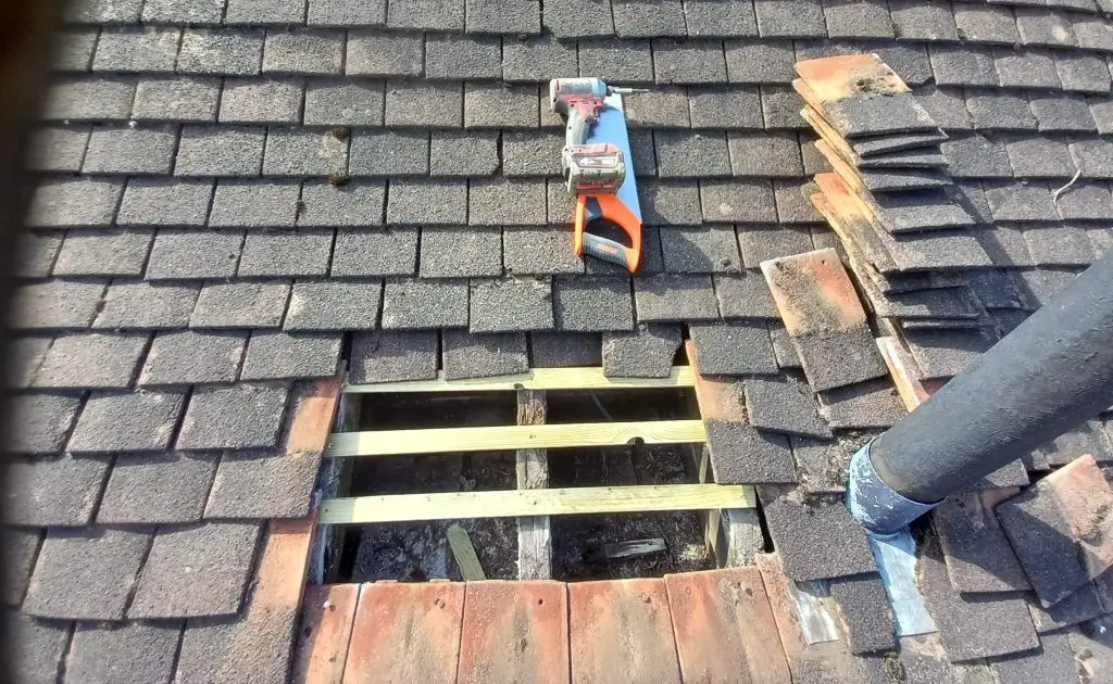 Section of roofing stripped down with tools ready for replacement by Northland Roofing roof repairs team.