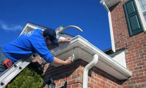 Northland Roofing technician handling Gutter and Flashing Repairs to maintain the integrity of the home's exterior drainage system.